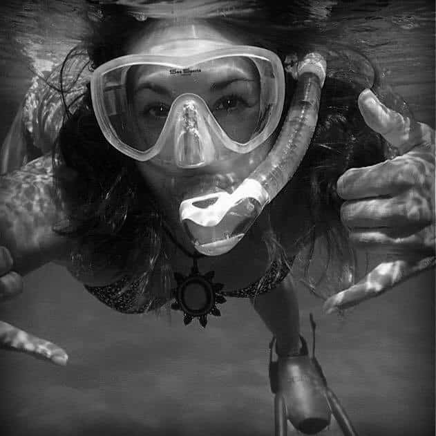 black and white photo of snorkeler facing the camera